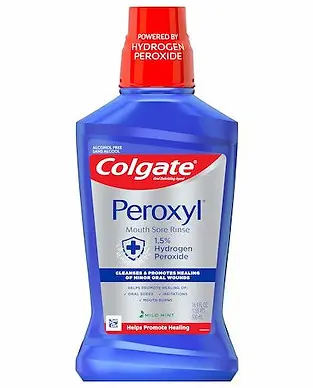 Image of a blue bottle of Colgate Peroxyl Mouth Sore Rinse with 1.5% Hydrogen Peroxide. The label states it cleanses and promotes healing of oral irritations and helps promote healing.