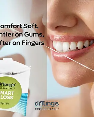 Close-up of a person flossing their teeth using drTung's SMART FLOSS. The image shows a box of the product with text highlighting its softness, gentleness on gums, and ease on fingers.