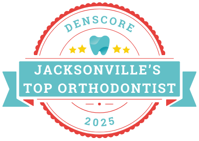 Badge image for Jacksonville's Top Orthodontist 2025, featuring a central tooth icon and labeled "Denscore" with a decorative ribbon and stars.