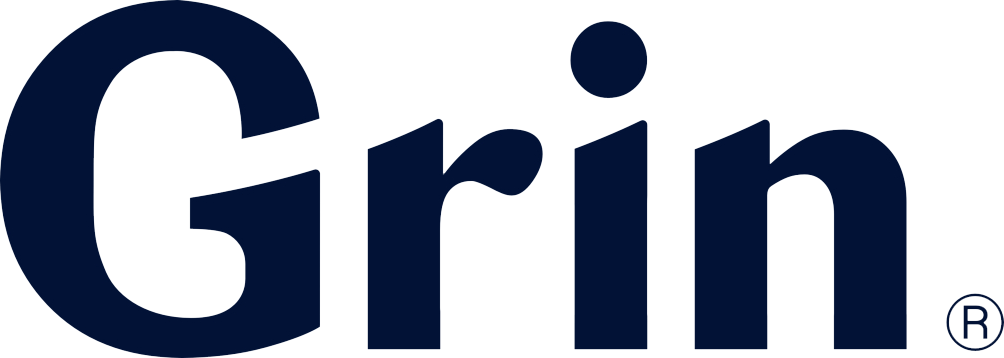 The word "Grin" in bold, black letters on a light blue background, followed by a registered trademark symbol.