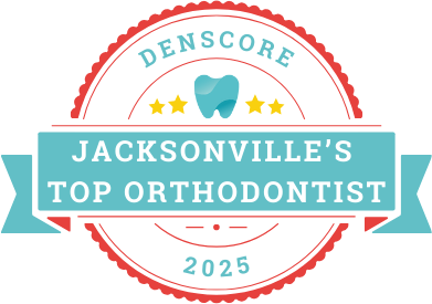 A badge with a tooth icon reads "Denscore Jacksonville's Top Orthodontist 2025" with three stars and a red border.