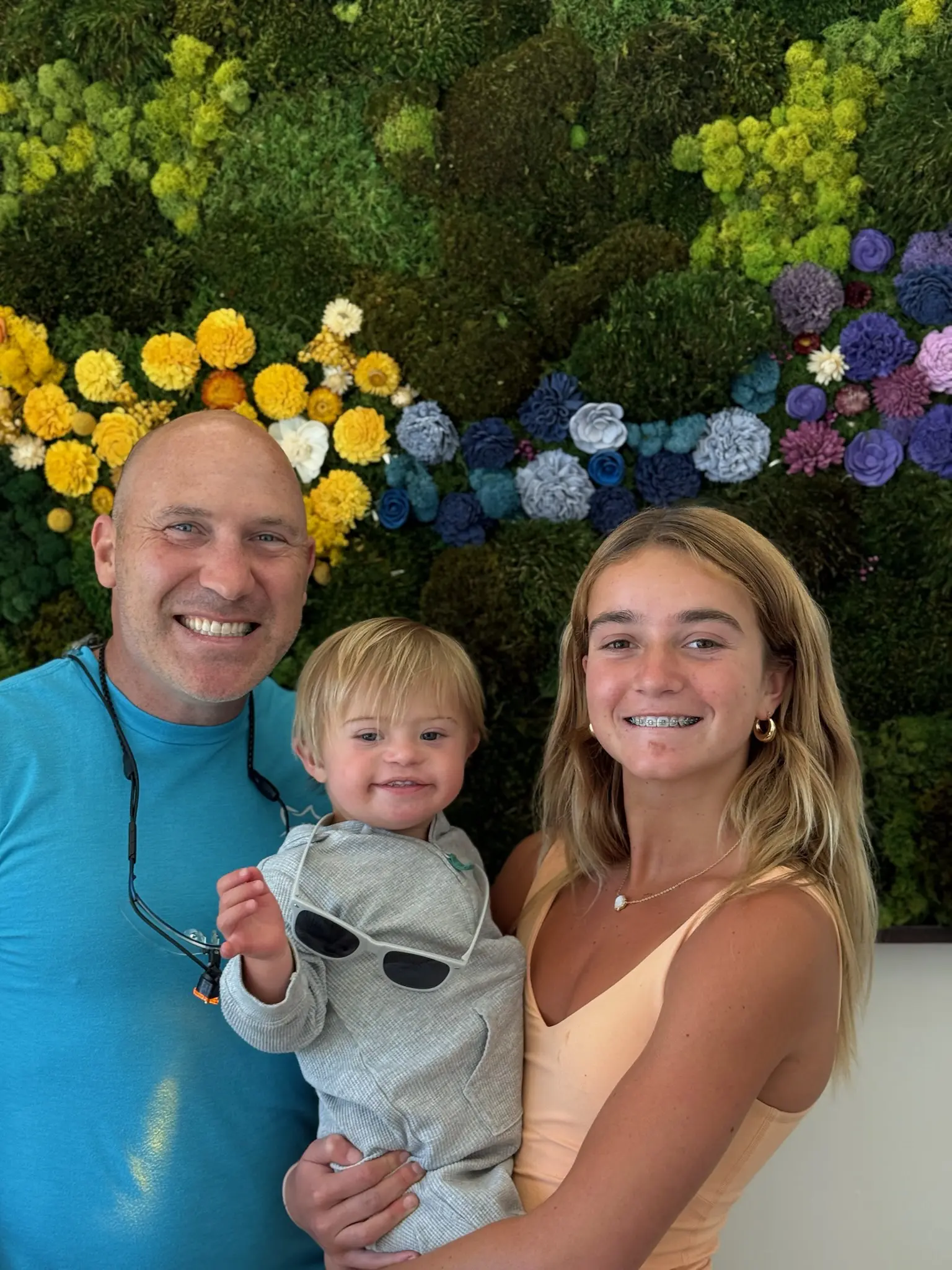 A beach scene with gentle waves washing onto the shore at sunset. The sky is a mix of soft pinks and oranges, and a person is visible in the distance near the water. A beach scene with gentle waves washing onto the shore at sunset. The sky is a mix of soft pinks and oranges, and a person is visible in the distance near the water.