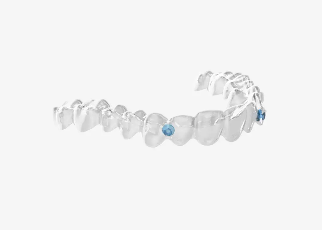 A clear dental aligner with blue markers on two teeth is showcased by Bold Bite Orthodontics in Jacksonville, FL against a plain white background.