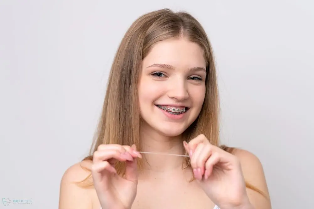 A beach scene with gentle waves washing onto the shore at sunset. The sky is a mix of soft pinks and oranges, and a person is visible in the distance near the water. A beach scene with gentle waves washing onto the shore at sunset. The sky is a mix of soft pinks and oranges, and a person is visible in the distance near the water.