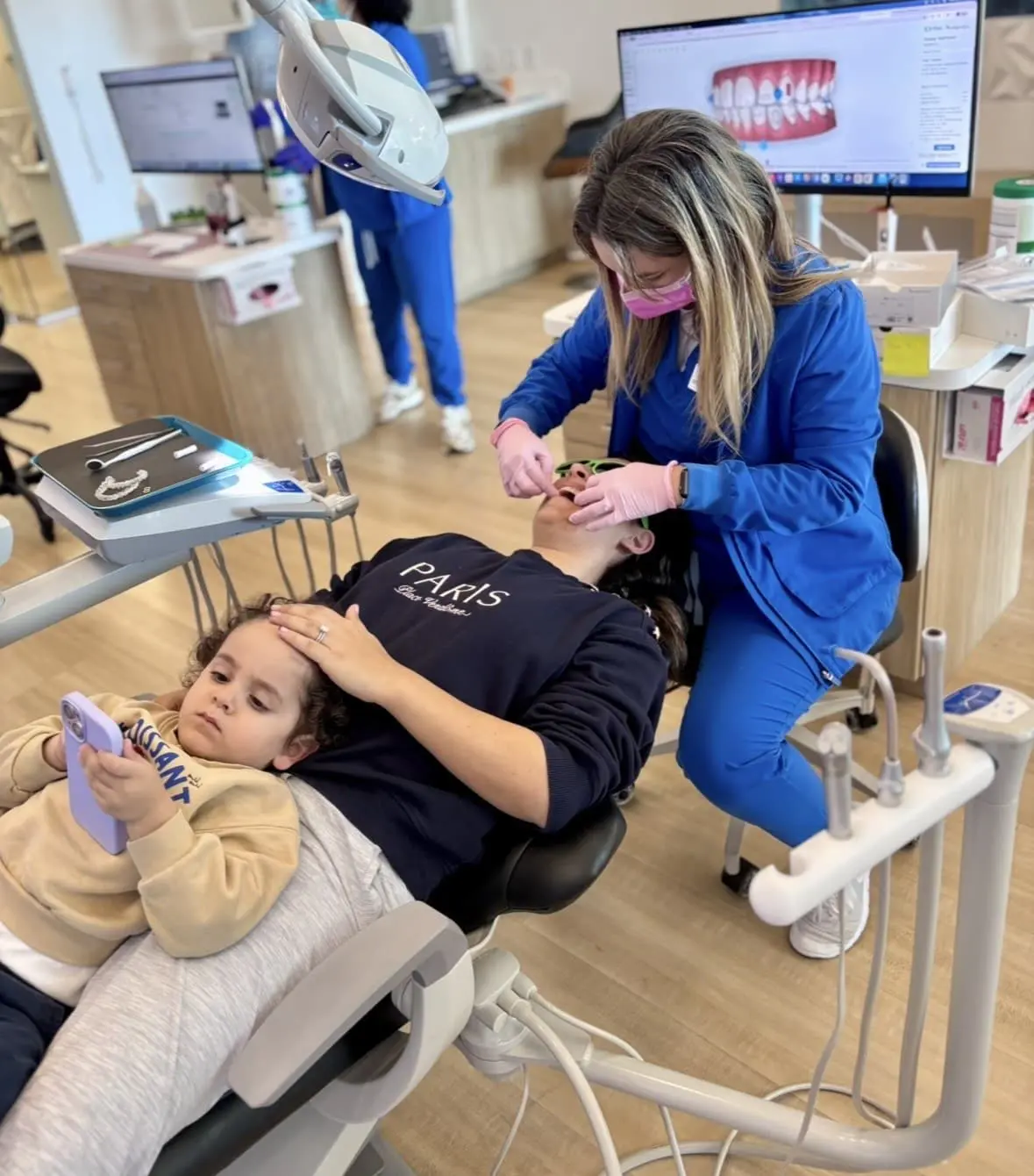 Bold Bite Orthodontics clinician calmly repairing a broken bracket for a patient in Jacksonville.